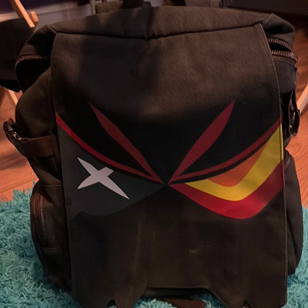 Anime backpack, lots of pockets and storage. All the zippers work